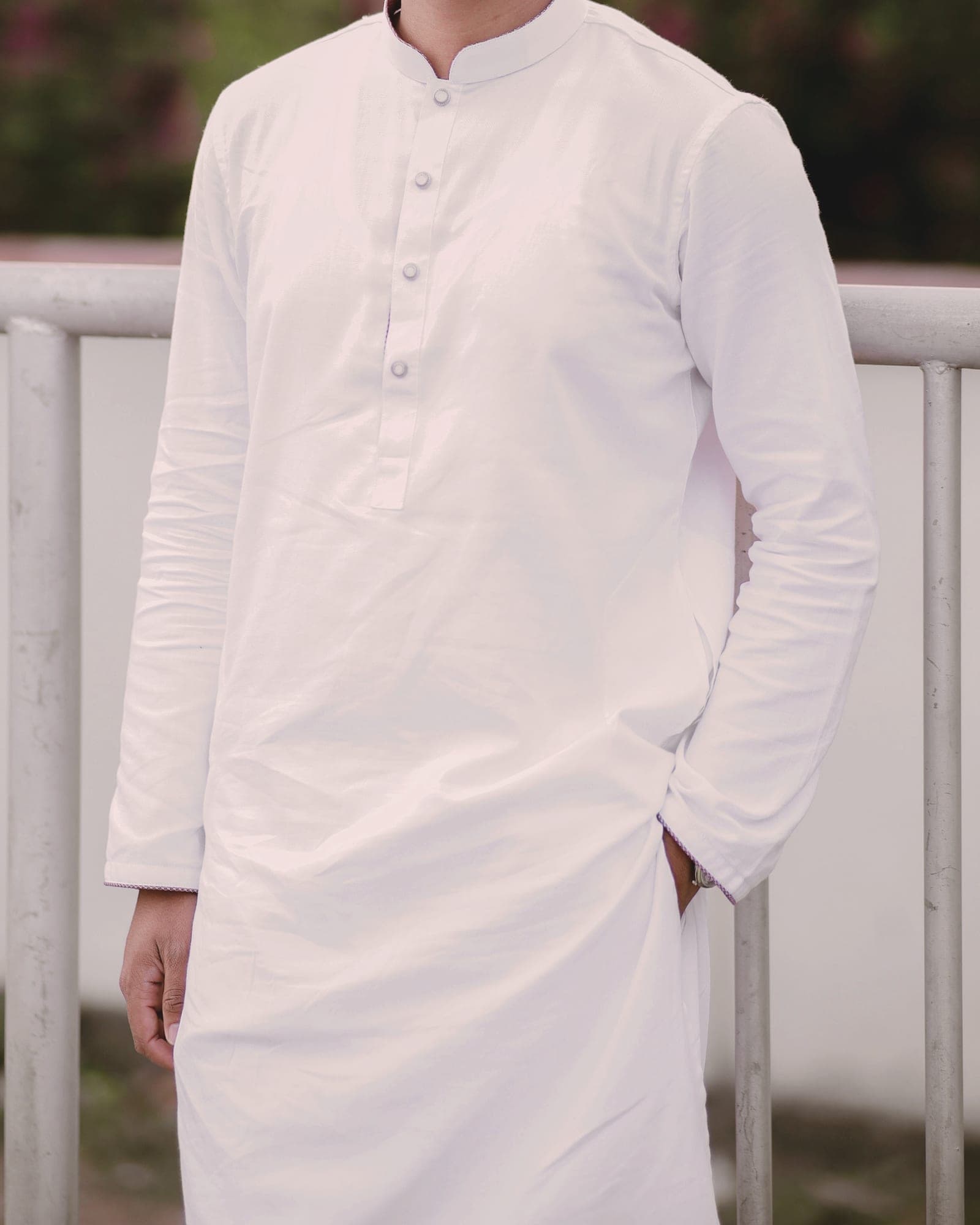 A white kurta shown straight on: band collar, button placket, shoulder seams and full-length sleeves